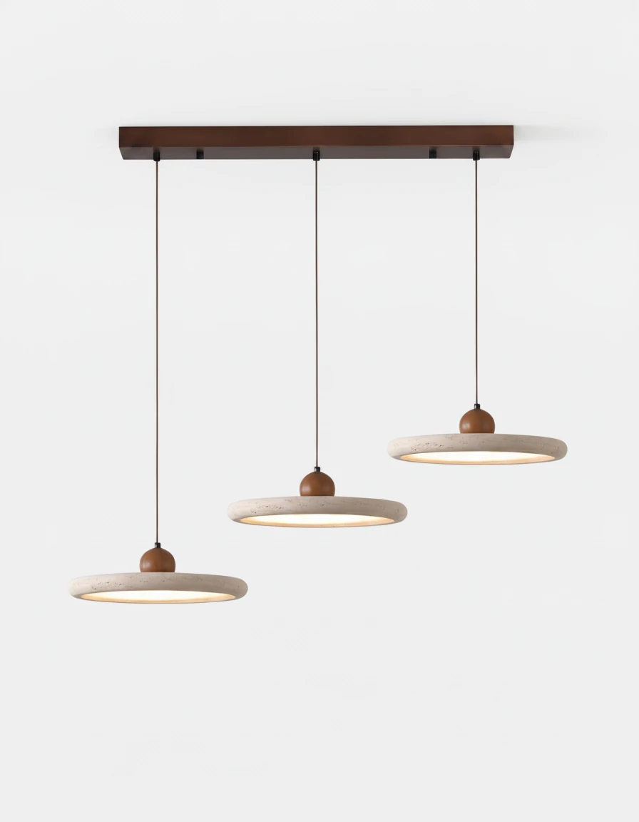 Three travertine pendant lights TONDO No.02 as a triple cluster on a linear walnut canopy, all switched on