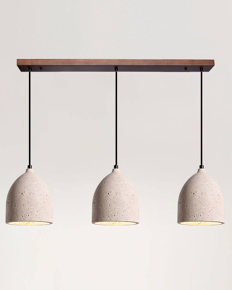 Three travertine pendant lights BOCCA No.01 on a triple linear walnut canopy, stone bells all switched on