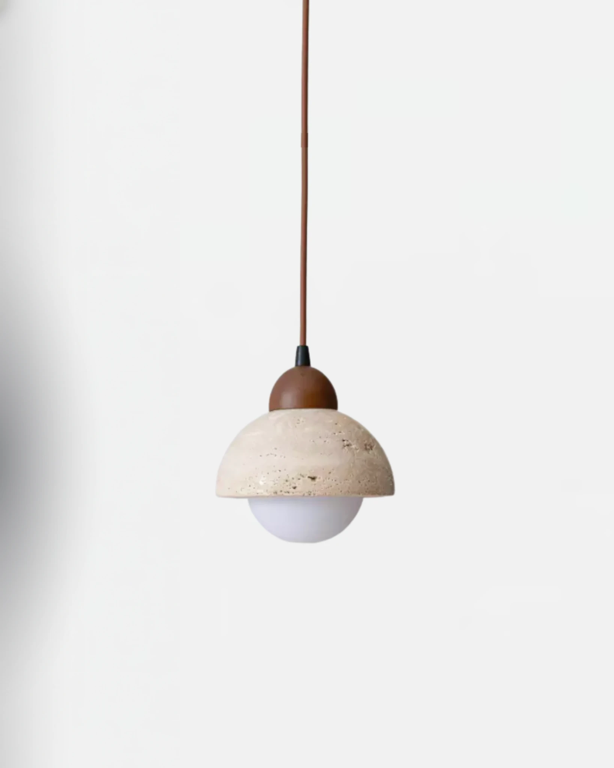 Travertine pendant light AVORIO No.04, yellow travertine hemisphere with walnut cap and opal bottom on a cord