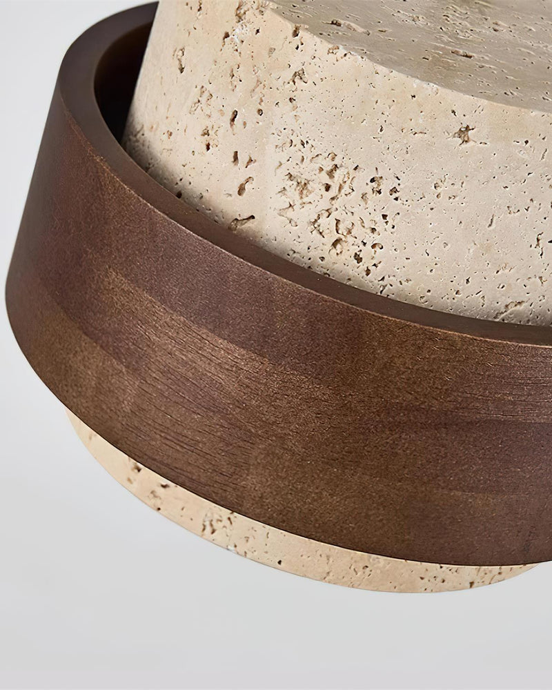 Close-up of the walnut belt edge and pitted travertine surface of the travertine wall sconce TIVOLI No.02