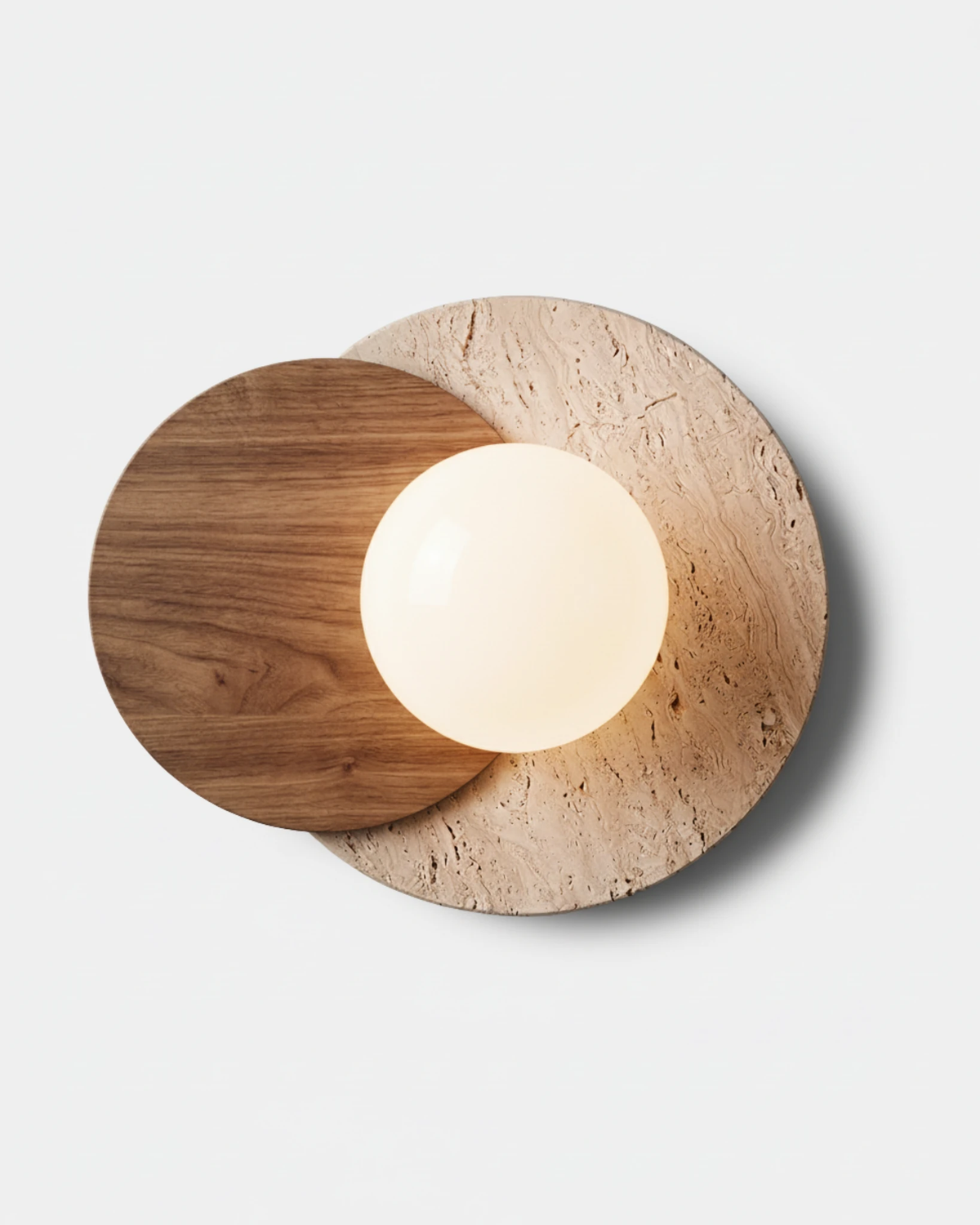 Travertine wall sconce AVORIO No.02, yellow travertine disc with a dark walnut eclipse and lit opal globe