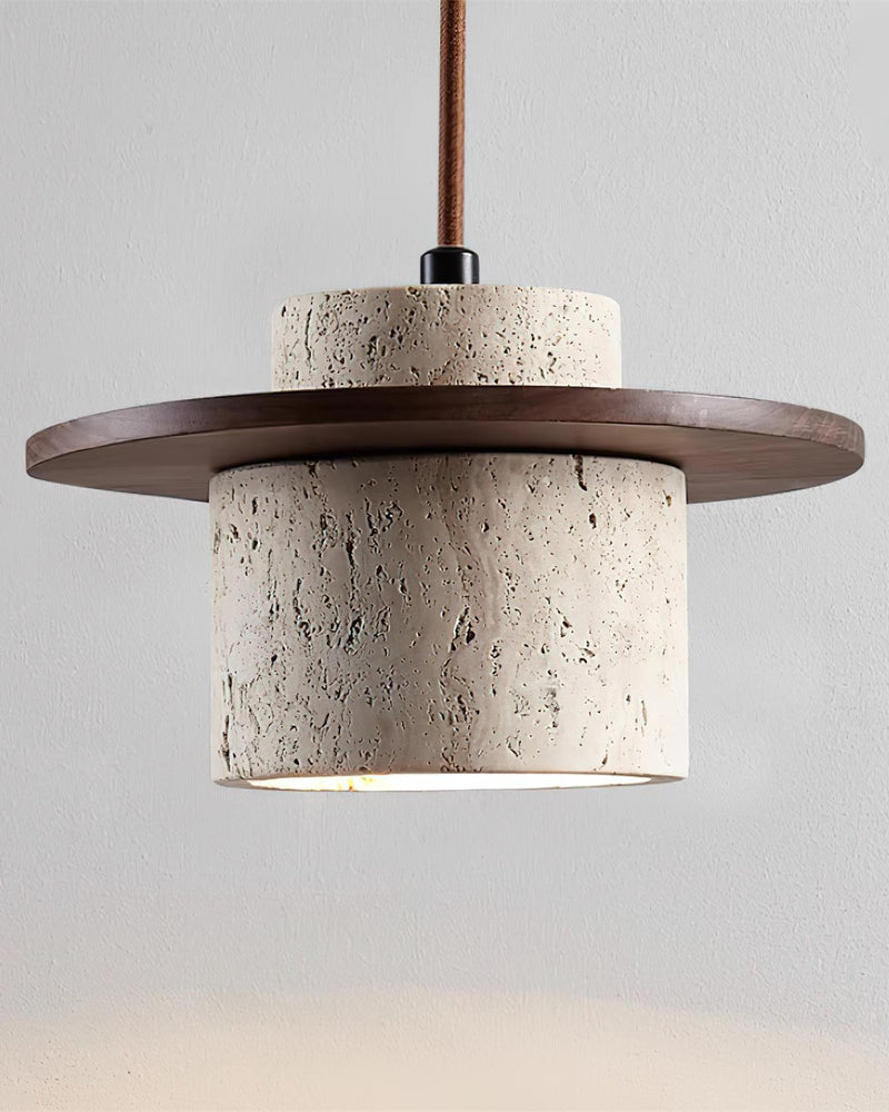 Travertine wall sconce TIVOLI No.01 shade with dark walnut disc hanging on a cord, switched on with a bright rim