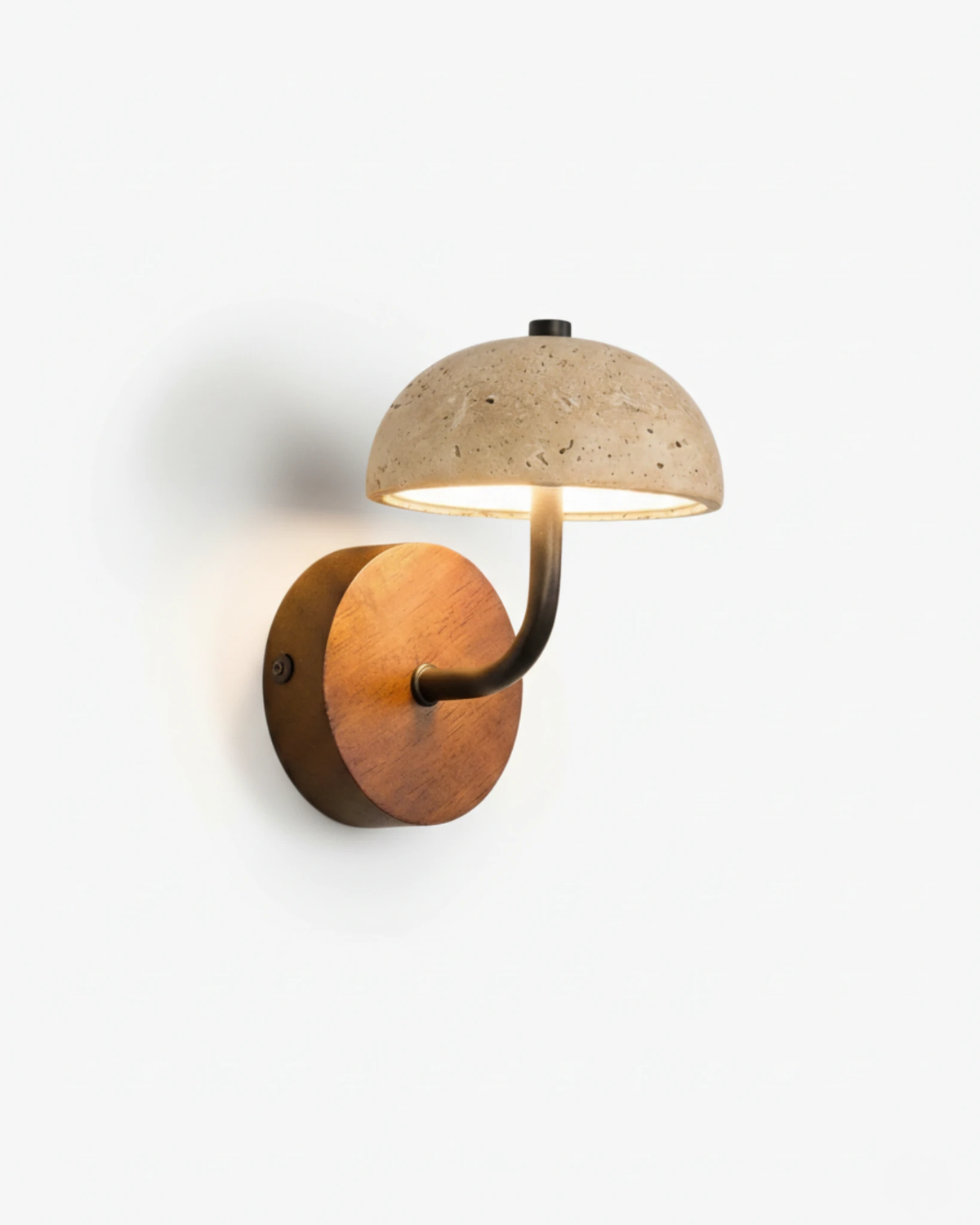 Travertine wall sconce SIENA No.01, travertine dome on a curved black arm from a walnut disc, switched on