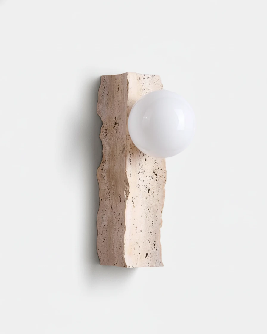 Travertine wall sconce KANSO No.03 in Raw Travertine, rough-edged stone slab with a white opal globe, switched off