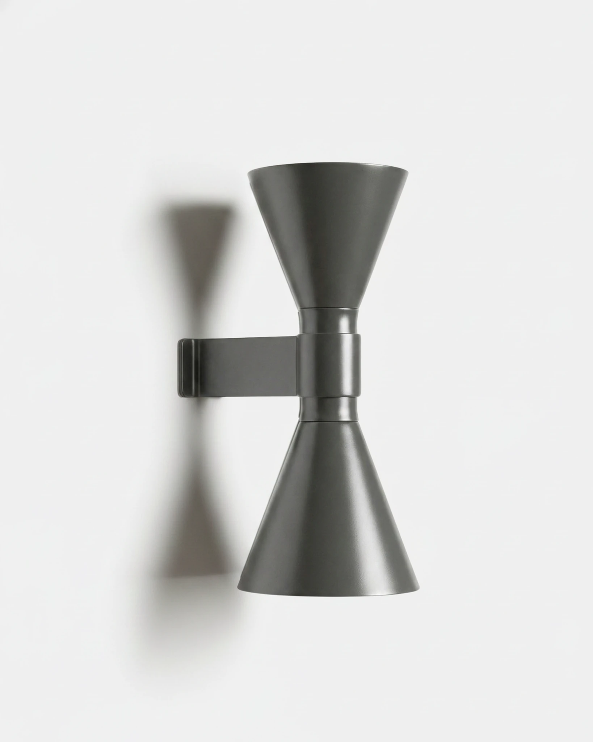 Up down wall sconce ECLISSI No.01 in Soft Gray, hourglass shaped double cone sconce on a plain background