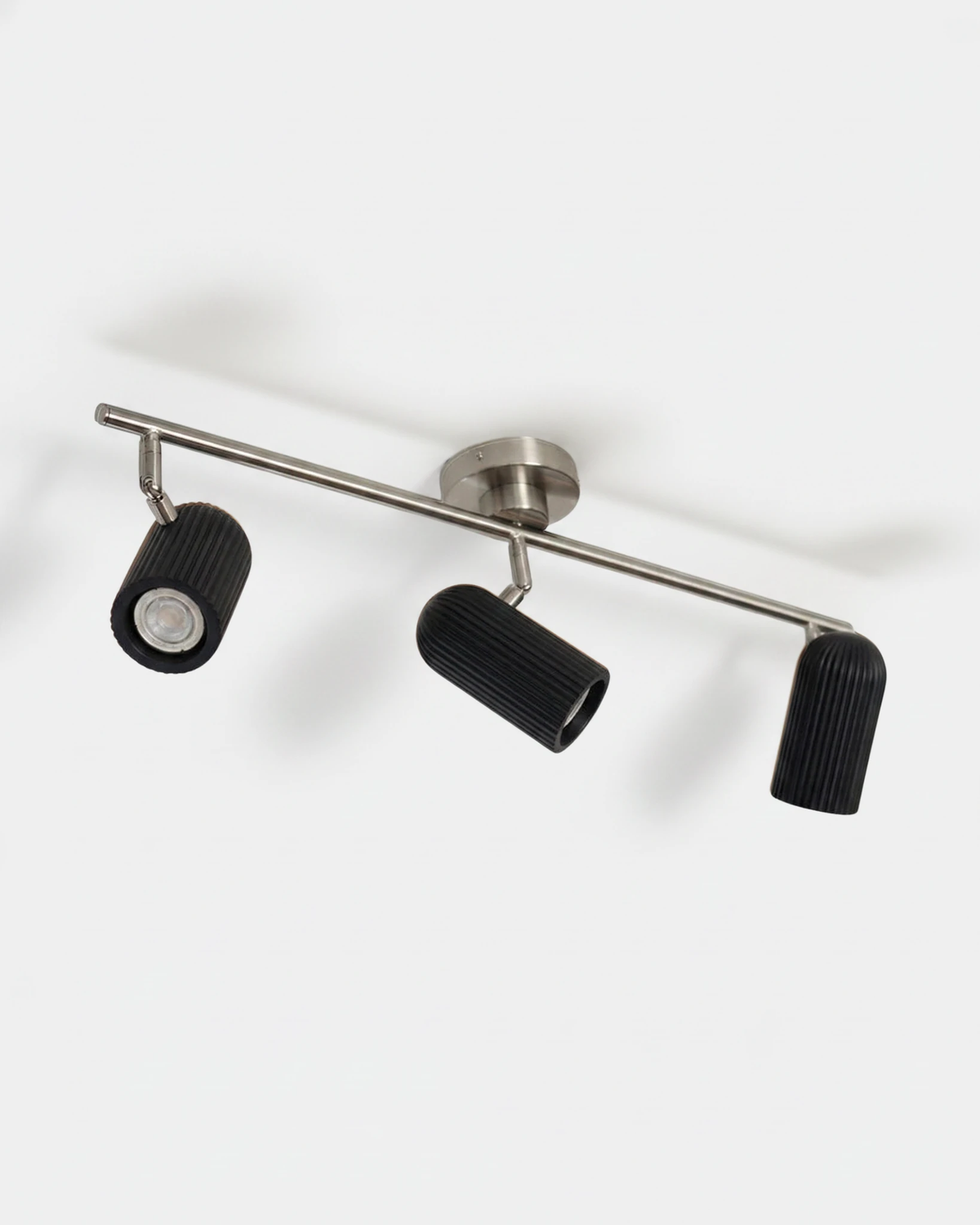 Wood flush mount ceiling light RIGA No.06 in deep black, three fluted adjustable spots on a nickel bar