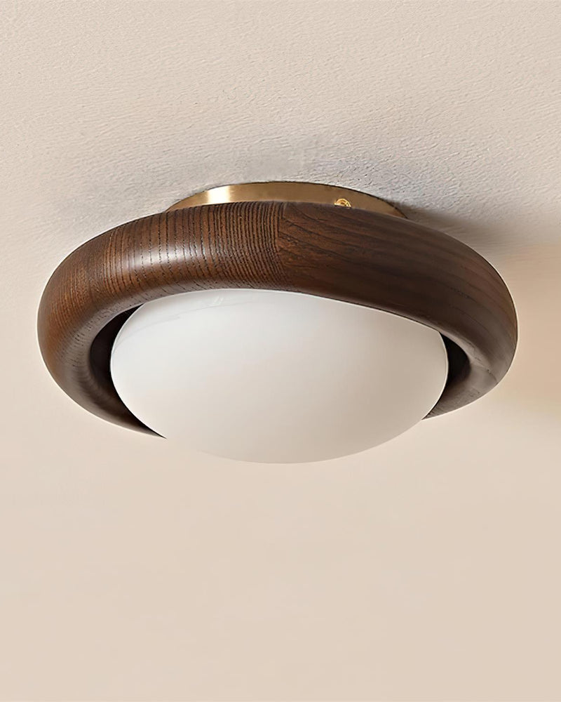 Close-up of the wood flush mount ceiling light MURA No.01 from the side, white opal dome inside the walnut ring