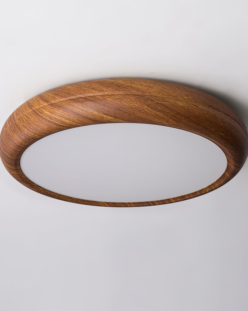 Wood flush mount ceiling light COMO No.01 seen from below, wood rim around a bright white diffuser