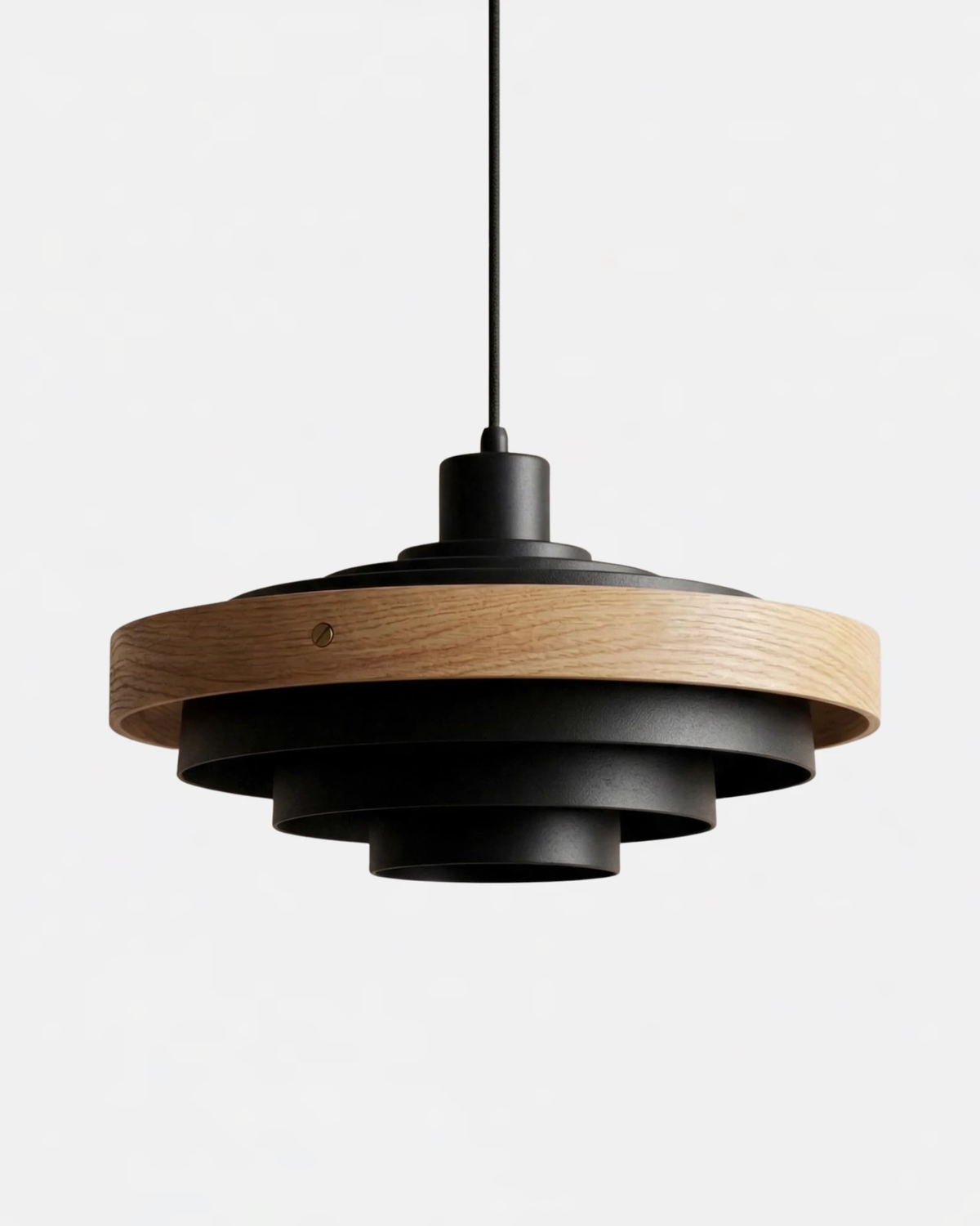 Wood pendant light STECCA No.01 in matte black with light walnut ring, stacked metal tiers, unlit