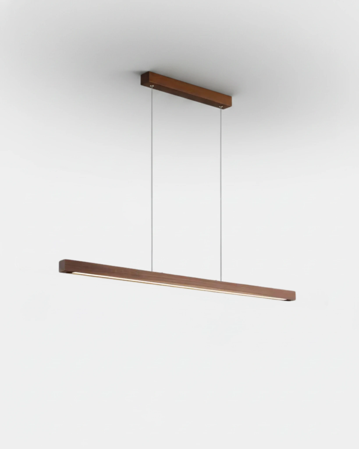 Wood pendant light VIRGA No.01 in the 39 in length, walnut brown LED bar with the light strip glowing underneath