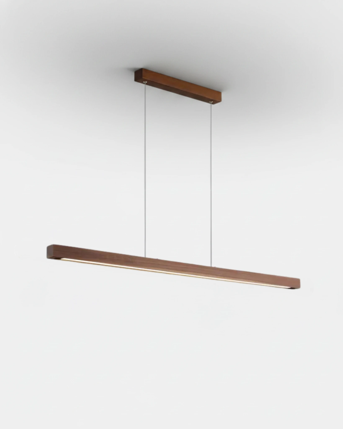 Wood pendant light VIRGA No.01 in 47 in walnut brown, slim linear bar with a soft light line along its underside