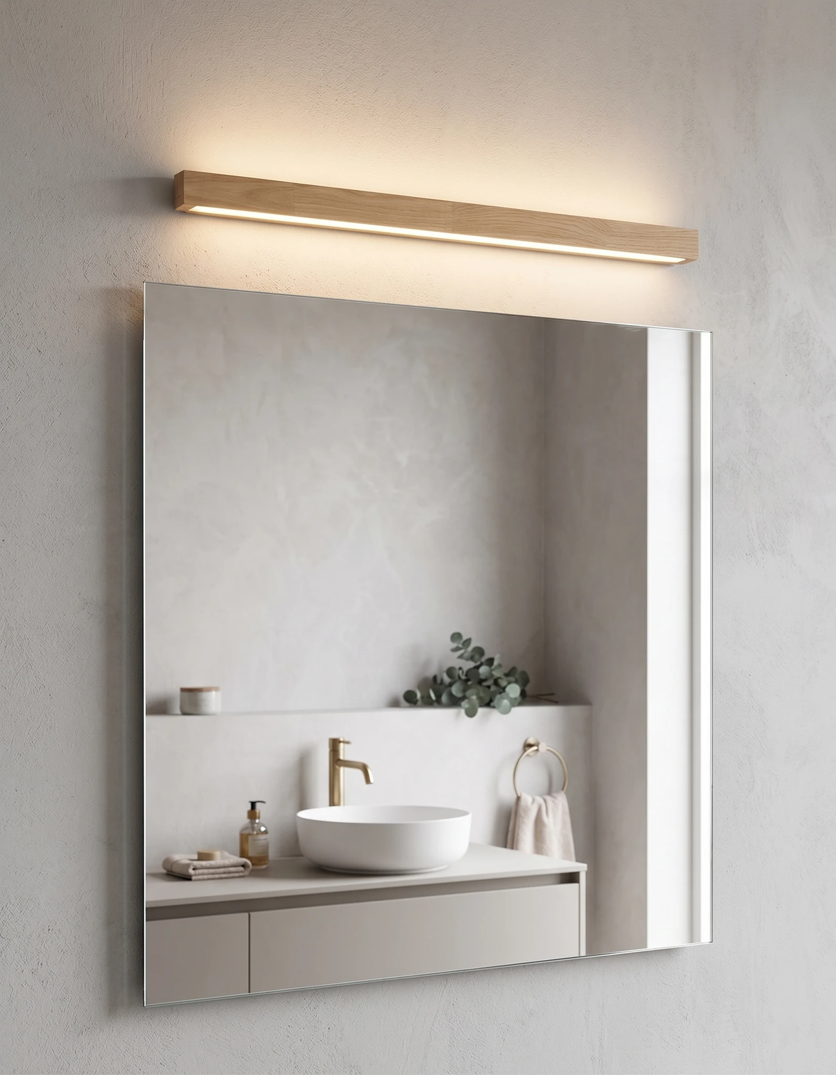 Wood wall sconce PIANO No.01 in light walnut, lit above a bathroom mirror and vanity basin