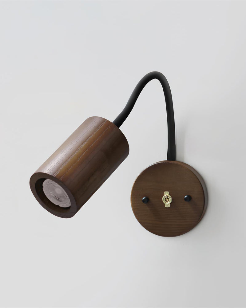 Wood wall sconce RIGA No.07, dark walnut cylinder spot head on a flexible black arm with a round backplate