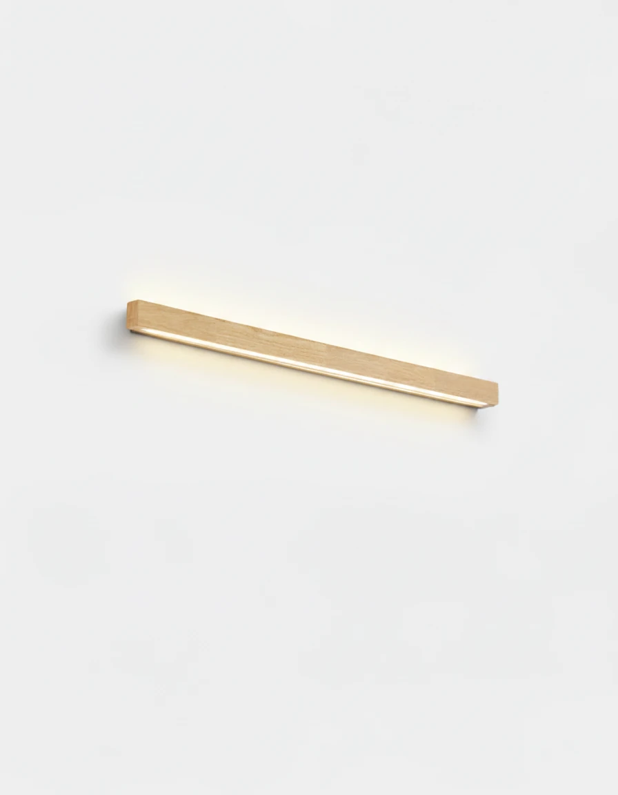 Wood wall sconce PIANO No.01 in light walnut, 60 cm bar with an up-and-down glow, switched on