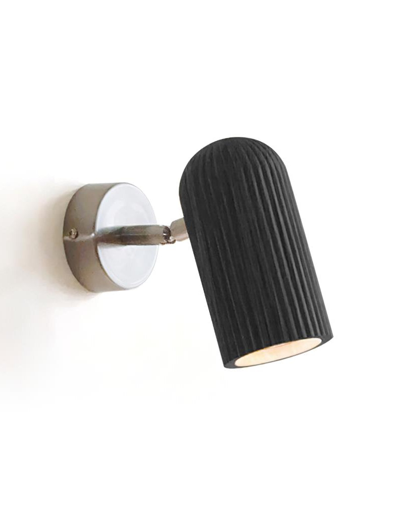Wood wall sconce NOTA No.01 with a matte black fluted spot head pivoting on a nickel bracket, unlit